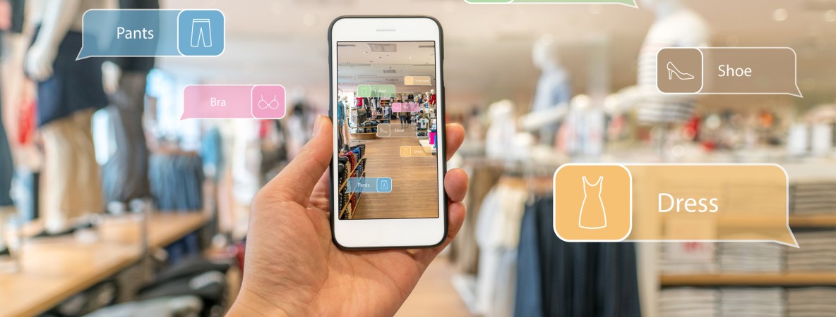 Augmented-reality-marketing.-Hand-holding-smart-phone-use-AR-application-to-check-information-658404