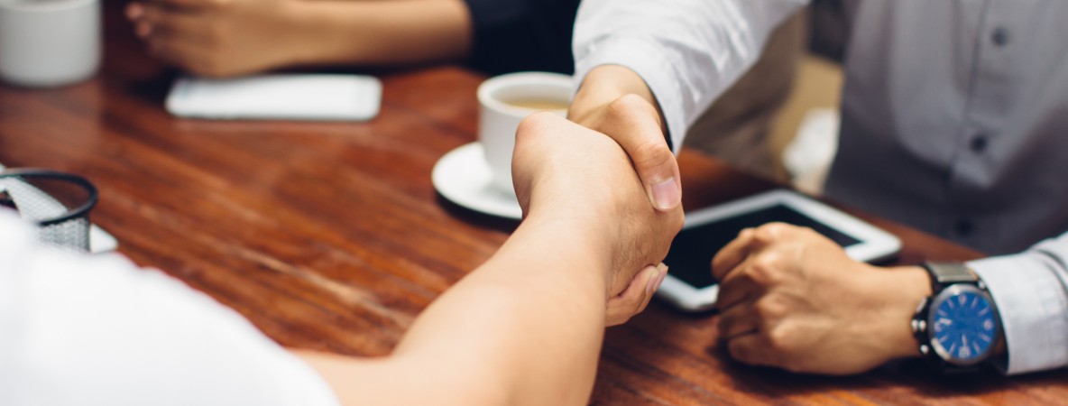 Close-up-of-businessmen-shaking-hands-610117816_3868x2578.jpeg