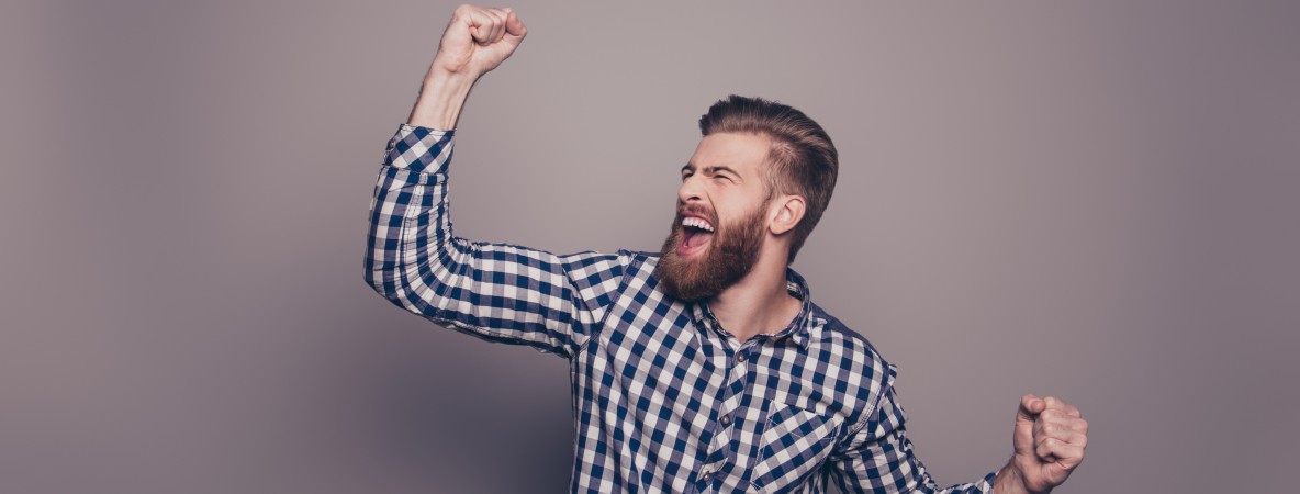 Yes,-he-did-it!--happy-bearded-man-raised-hands-636831346_3866x2580.jpeg