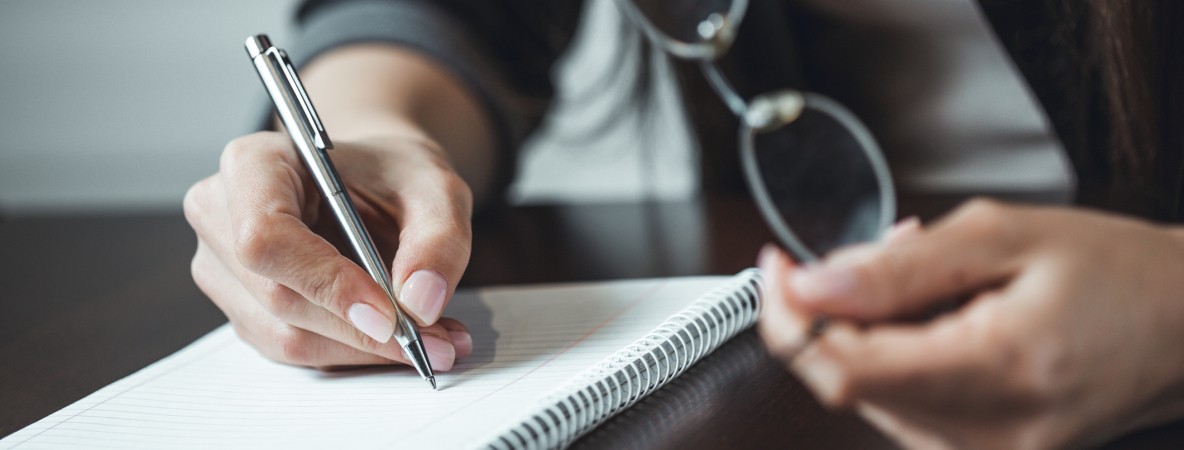 Close-up-shot-of-human-hand-writing-something-on-the-paper.-Shallow-DOF.-Focus-on-pencil-680568334_2