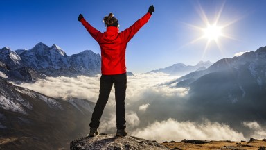 Woman-lifts-her-arms-in-victory,-Mount-Everest-National-Park-507910624_5616x3744.jpeg
