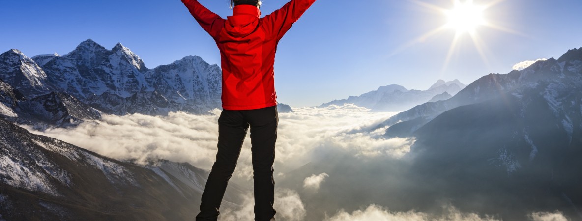 Woman-lifts-her-arms-in-victory,-Mount-Everest-National-Park-507910624_5616x3744.jpeg