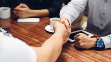 Close-up-of-businessmen-shaking-hands-610117816_3868x2578.jpeg