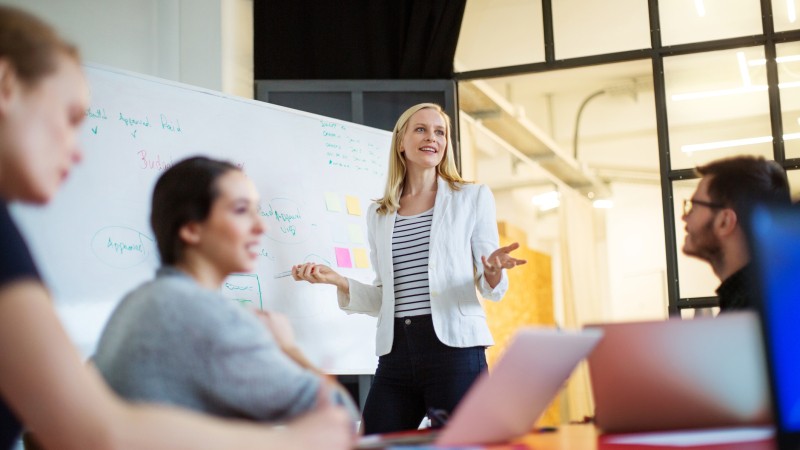 Businesswoman-giving-presentation-on-future-plans-to-colleagues-576902490_2125x1416.jpeg