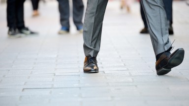 Business-man-in-suit-taking-a-big-fast-step-forward-512594944_3005x2000.jpeg