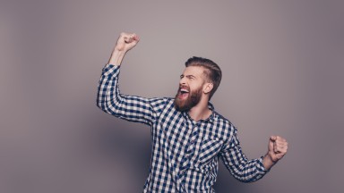 Yes,-he-did-it!--happy-bearded-man-raised-hands-636831346_3866x2580.jpeg