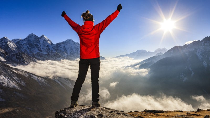 Woman-lifts-her-arms-in-victory,-Mount-Everest-National-Park-507910624_5616x3744.jpeg